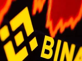file-photo-binance-logo-and-stock-graph-are-displayed-in-this-illustration
